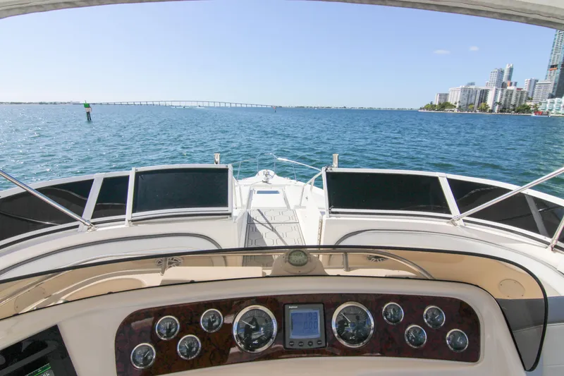 Slide: The Image of Cockpit view from 2000 Sea Ray 450 Express Bridge, overlooking ocean and city skyline. - 42