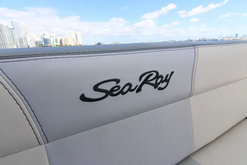 Slide: The Image of Sea Ray 450 Express Bridge 2000 boat interior with city skyline in background. - 45