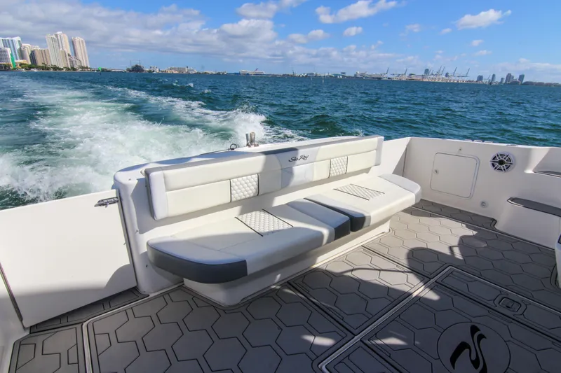 Slide: The Image of 2000 Sea Ray 450 Express Bridge cruising with city skyline in background. - 46