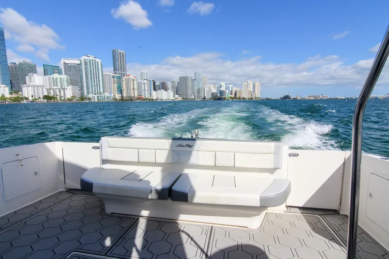 Slide: The Image of Sea Ray 450 Express Bridge cruising with city skyline in the background, 2000 model. - 47