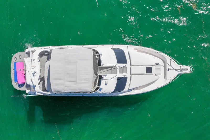 Slide: The Image of Aerial view of 2000 Sea Ray 450 Express Bridge yacht on green water. - 9