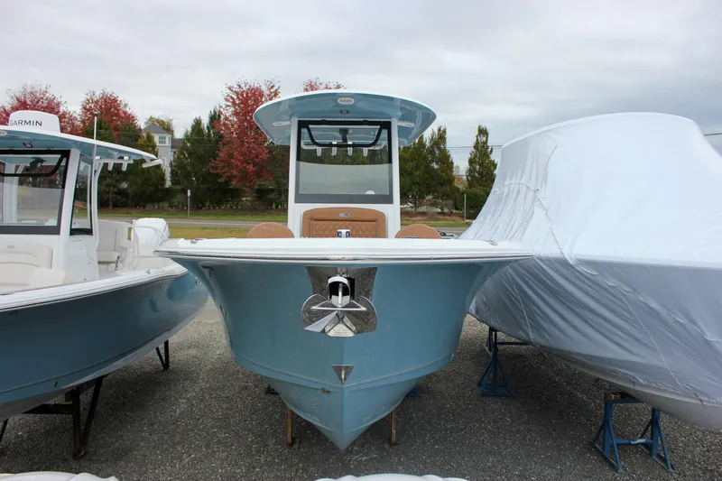 Slide: The Image of 2026 Sea Hunt Ultra 265 SE boat with Yamaha engines, blue hull, and modern design. - 1