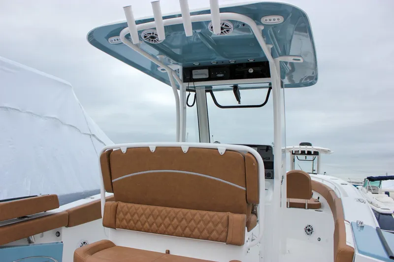 Slide: The Image of 2026 Sea Hunt Ultra 265 SE boat interior with handrail and storage compartment. - 13