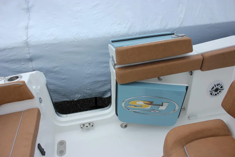 Slide: The Image of 2026 Sea Hunt Ultra 265 SE boat with tan cushioned seating and dual Yamaha engines. - 15