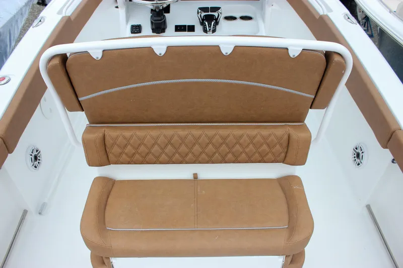 Slide: The Image of Brown cushioned seating on 2026 Sea Hunt Ultra 265 SE boat interior. - 20
