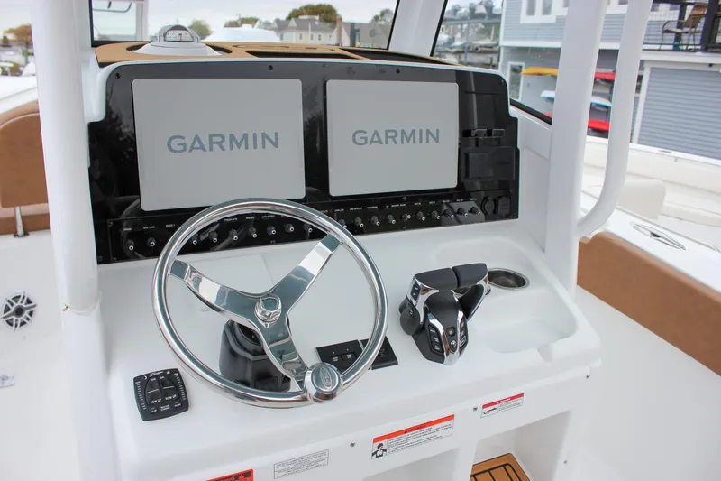Slide: The Image of 2026 Sea Hunt Ultra 265 SE boat interior view at marina. - 27