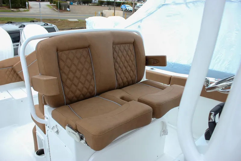 Slide: The Image of 2026 Sea Hunt Ultra 265 SE boat with luxurious brown leather seating. - 33