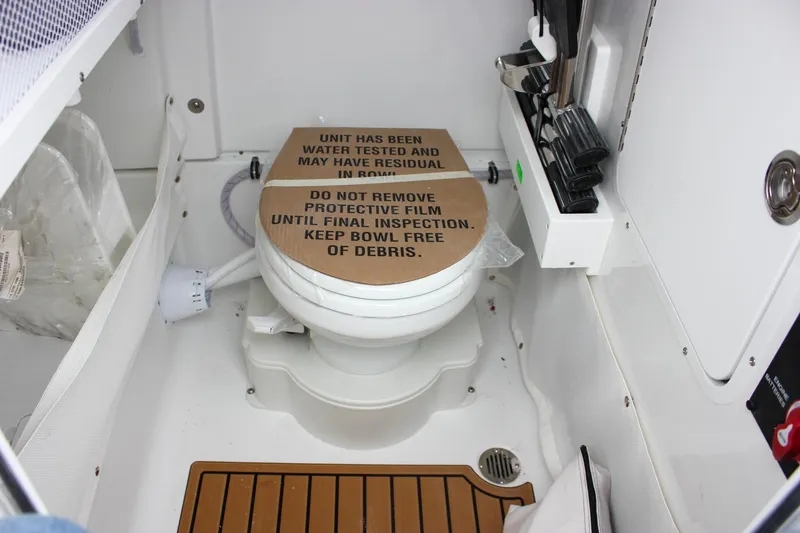 Slide: The Image of Control panel and storage area inside 2026 Sea Hunt Ultra 265 SE boat. - 45