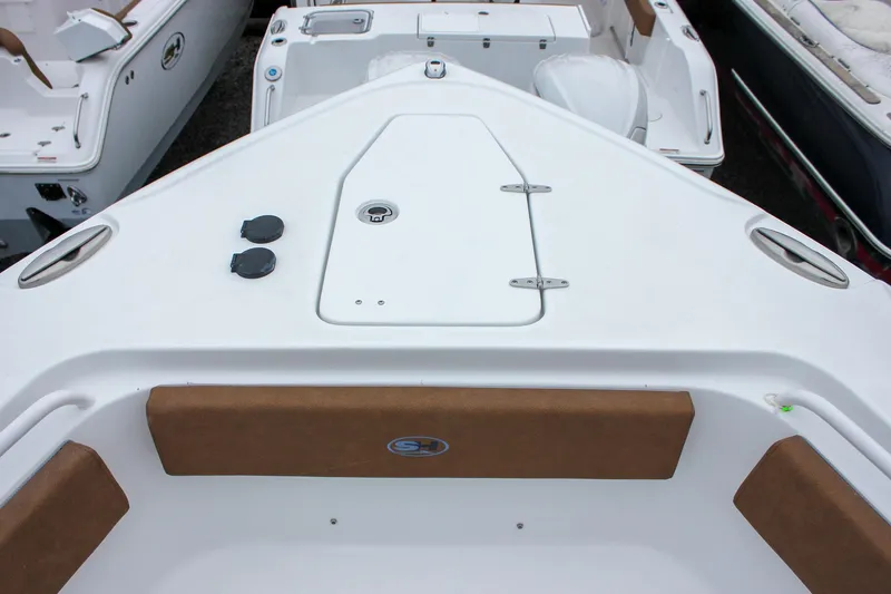 Slide: The Image of 2026 Sea Hunt Ultra 265 SE boat bathroom with protective film on toilet. - 46