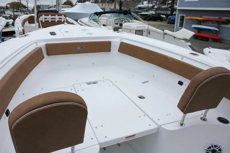 Slide: The Image of Anchor compartment of 2026 Sea Hunt Ultra 265 SE boat, featuring chain and winch. - 48