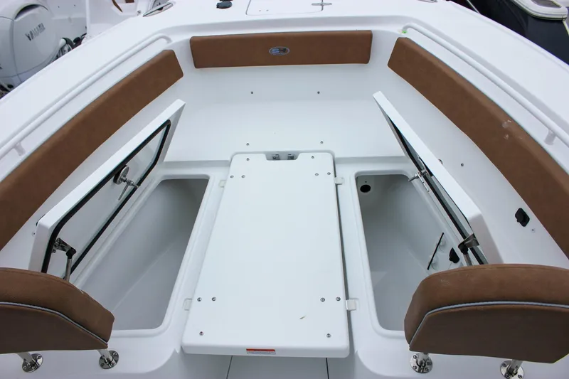 Slide: The Image of Open storage compartment on 2026 Sea Hunt Ultra 265 SE boat. - 54