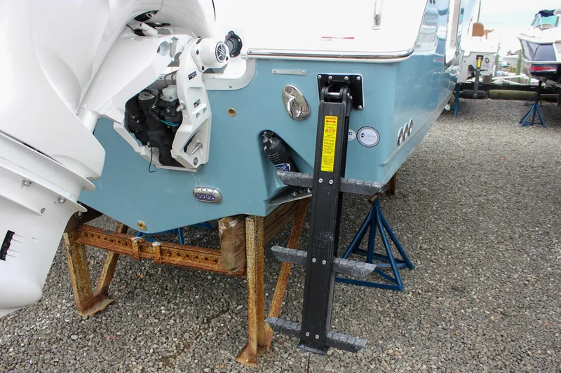 Slide: The Image of 2026 Sea Hunt Ultra 265 SE boat with blue hull and modern console. - 6