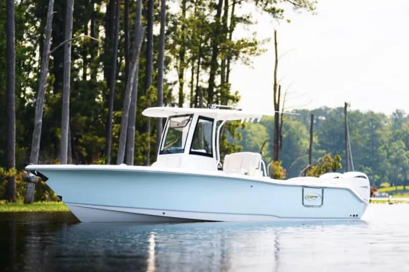 Slide: The Image of Manufacturer Provided Image: Aerial view of 2026 Sea Hunt Ultra 265 SE boat cruising on open water. - 64