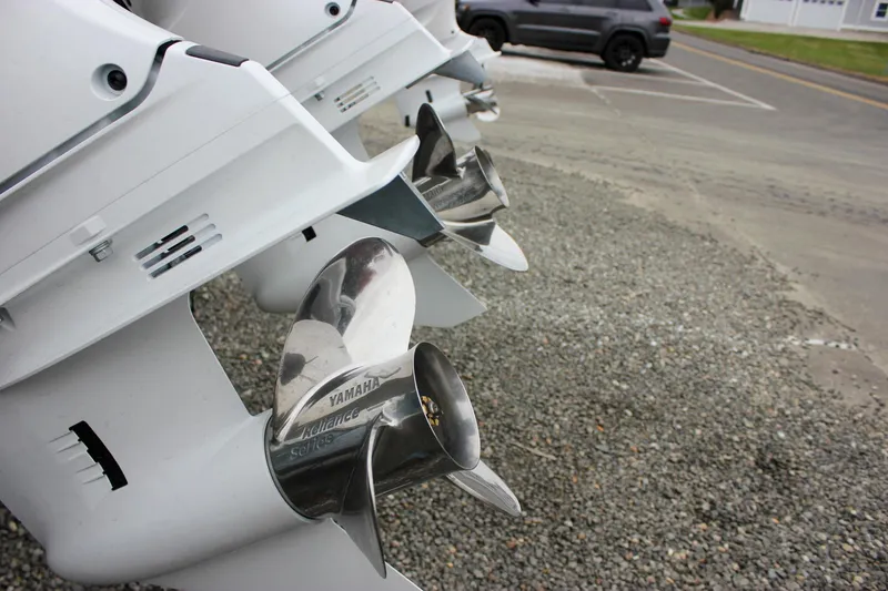 Slide: The Image of 2026 Sea Hunt Ultra 265 SE boat on stands, showing rear ladder and engine details. - 7