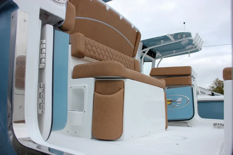 Slide: The Image of 2026 Sea Hunt Ultra 265 SE boat on a stand, showcasing dual engines. - 9