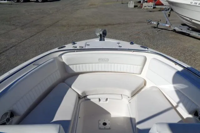 Slide: The Image of 2015 Robalo R247 Dual Console boat with spacious seating and sleek design. - 16