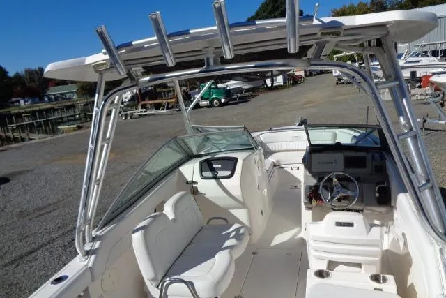 Slide: The Image of 2015 Robalo R247 Dual Console boat with spacious seating and modern dashboard. - 27