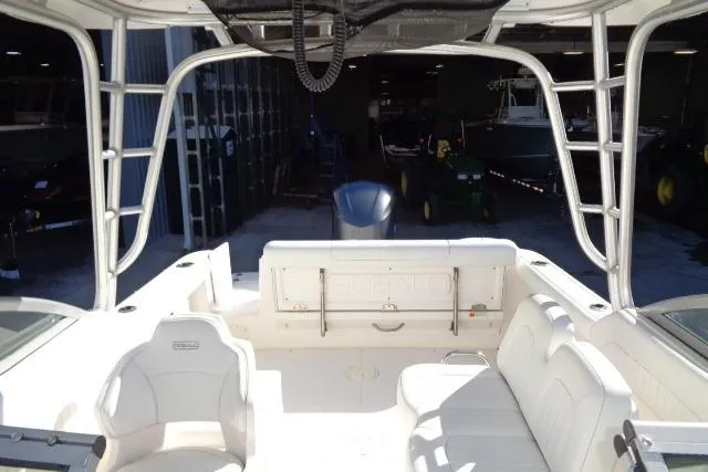 Slide: The Image of 2015 Robalo R247 Dual Console boat interior with seating and storage. - 34