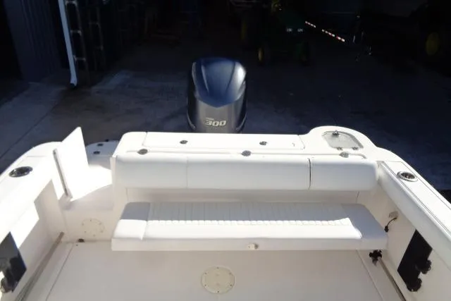 Slide: The Image of 2015 Robalo R247 Dual Console boat with Yamaha 300 engine, rear seating view. - 38