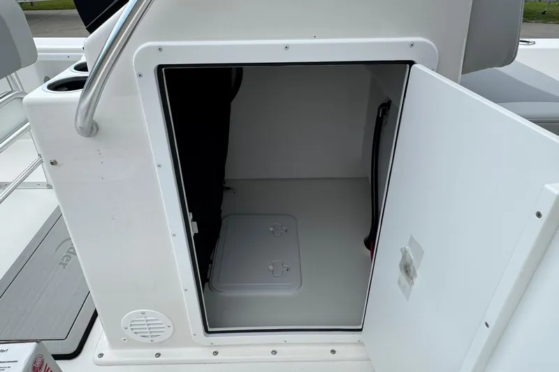 Slide: The Image of Open storage compartment on 2025 BayRider 2060 boat, featuring sleek white interior design. - 12
