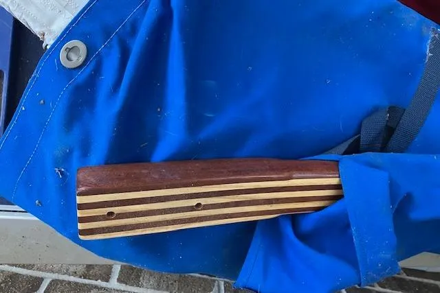 Slide: The Image of Wooden handle on blue fabric, Chrysler 26, 1979 model. - 13