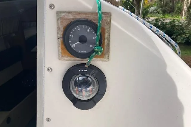 Slide: The Image of 1979 Chrysler 26 boat dashboard with compass and speedometer. - 19