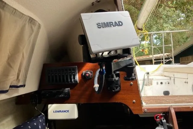 Slide: The Image of 1979 Chrysler 26 boat interior with Simrad and Lowrance navigation equipment. - 21