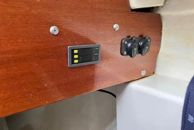 Slide: The Image of 1979 Chrysler 26 interior panel with digital display and switches. - 34