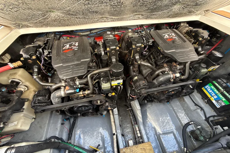 Slide: The Image of Engine compartment of a 2004 Sea Ray 280 Sundancer with twin MerCruiser 4.3 MPI engines. - 16