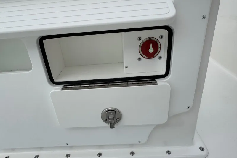 Slide: The Image of Bay Rider 2060 boat compartment with a red control knob, 2025 model. - 16