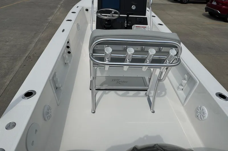 Slide: The Image of 2025 Bay Rider 2060 boat interior with steering console and rod holders. - 19