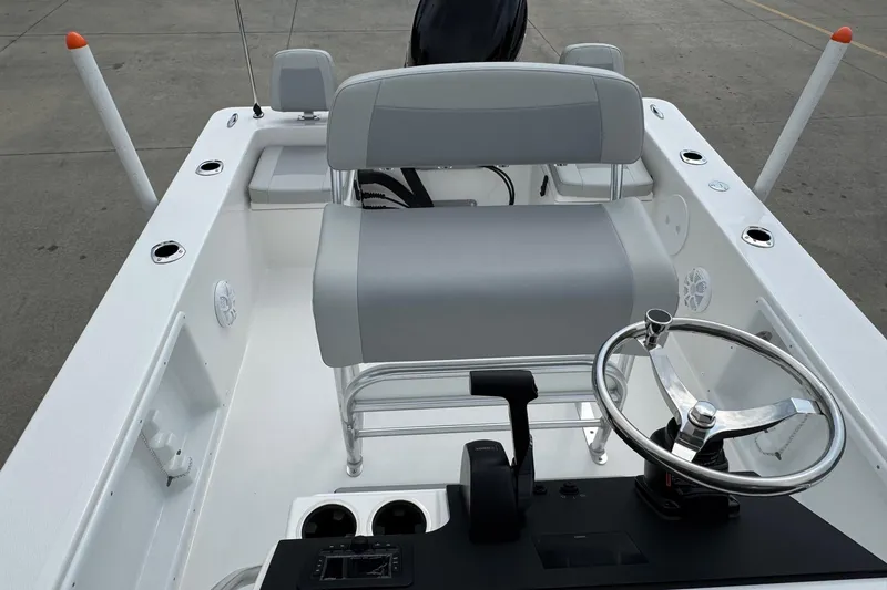 Slide: The Image of Bay Rider 2060 boat interior, featuring steering wheel and seating, 2025 model. - 10