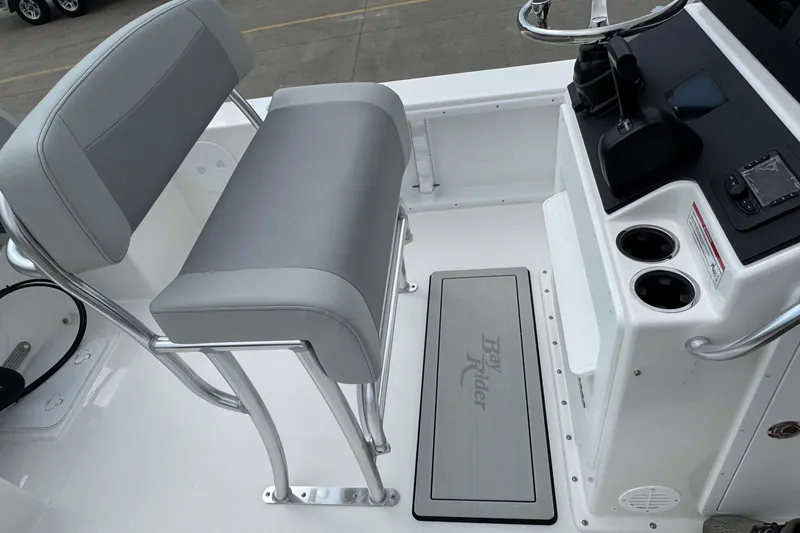Slide: The Image of 2025 Bay Rider 2060 boat interior with gray seating and steering console. - 11