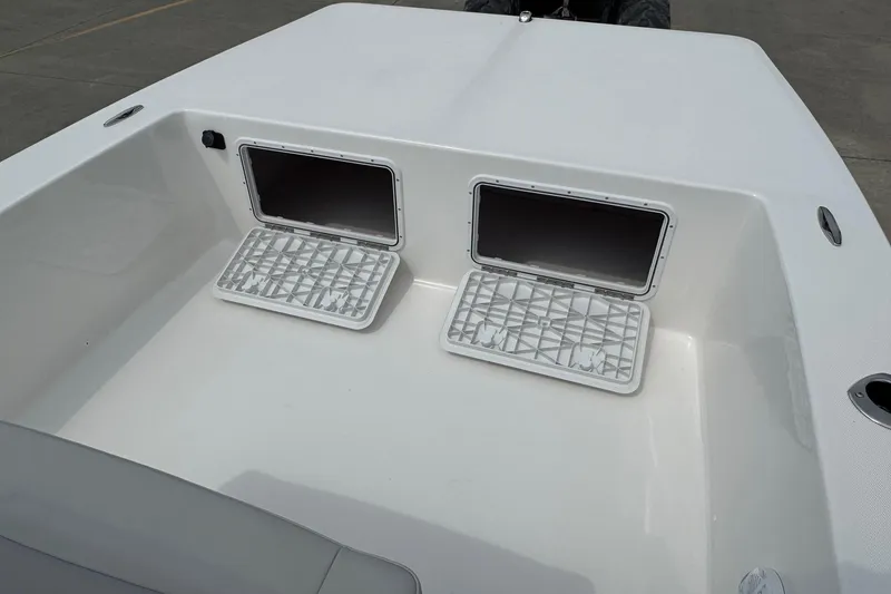 Slide: The Image of Bay Rider 2060 boat storage compartments, 2025 model, open hatches on deck. - 7