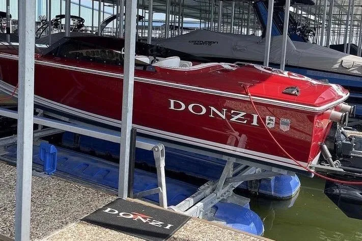 Slide: The Image of Red 2017 Donzi 22 Classic boat docked in a marina. - 11