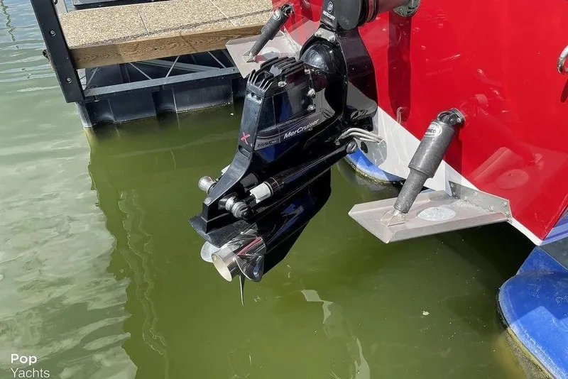 Slide: The Image of 2017 Donzi 22 Classic boat with MerCruiser engine in water, docked. - 14