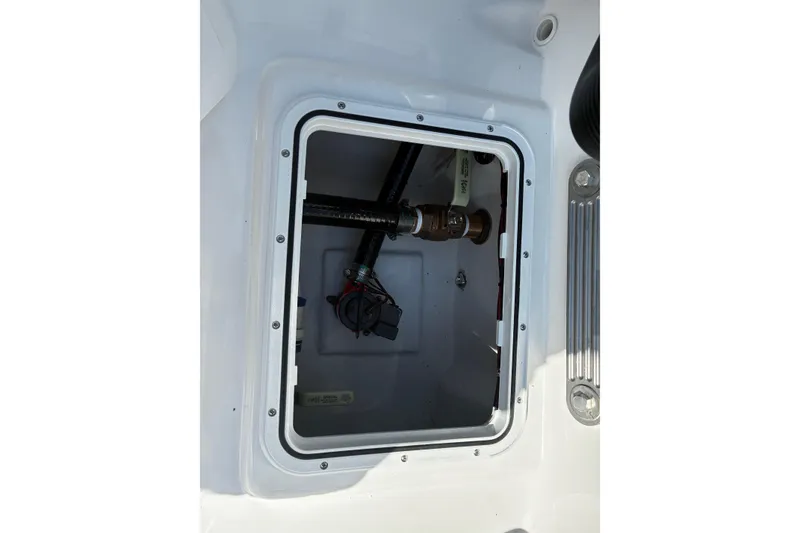 Slide: The Image of Bay Rider 2260 boat compartment interior, showcasing wiring and plumbing, 2026 model. - 11