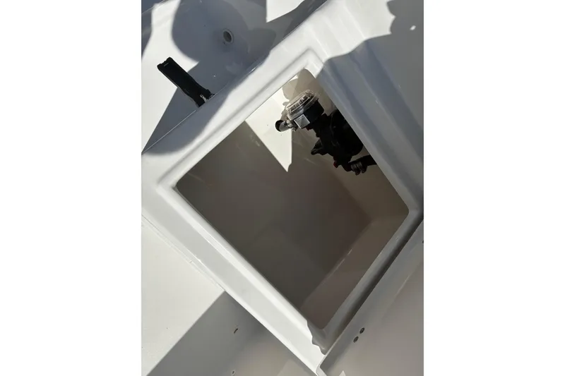 Slide: The Image of 2026 Bay Rider 2260 boat compartment with visible plumbing components. - 12