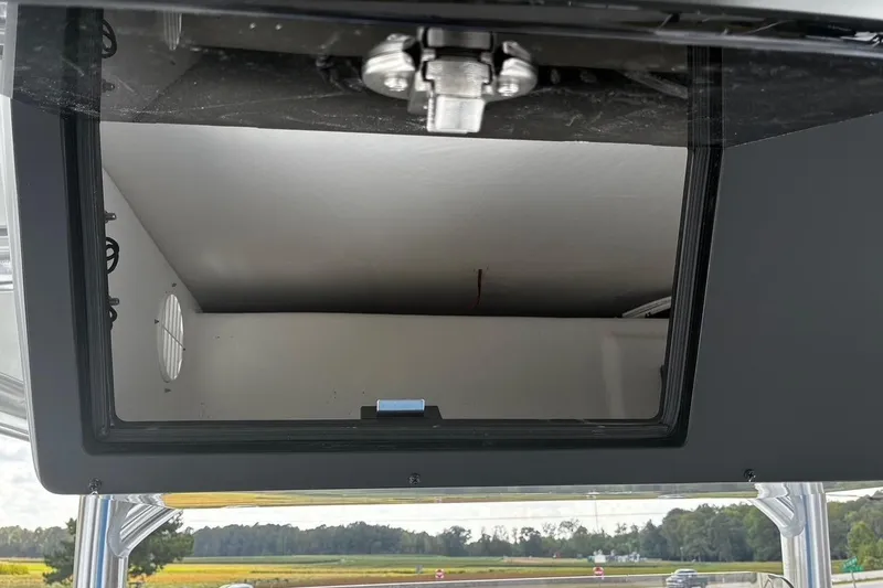 Slide: The Image of Open storage compartment on a 2026 Bay Rider 2260 boat, showcasing interior space. - 15