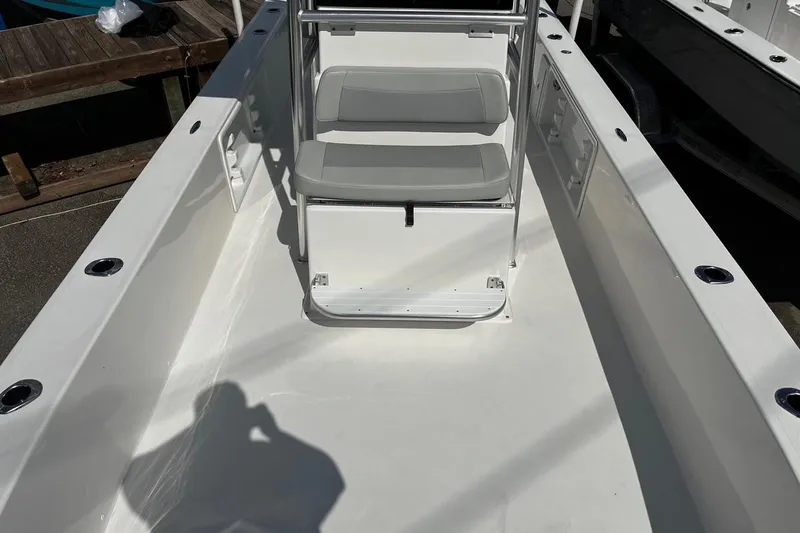 Slide: The Image of Bay Rider 2260 boat interior, 2026 model, featuring a clean deck and seating area. - 6