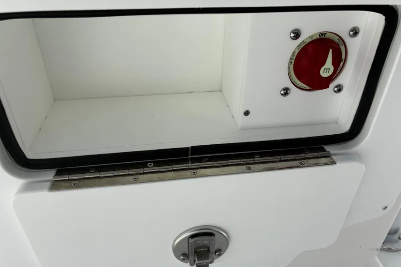 Slide: The Image of Bay Rider 2260 boat compartment with red control knob, 2026 model. - 8
