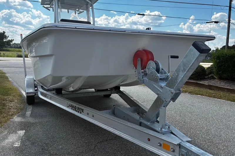 Slide: The Image of 2026 Bay Rider 2260 boat on Load Rite trailer, parked on a sunny day. - 3