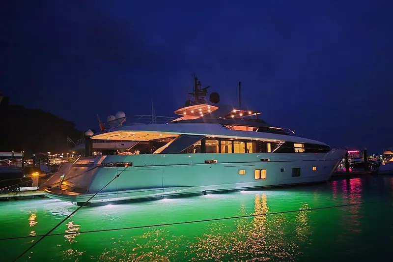 Slide: The Image of Luxurious 2022 Sanlorenzo SL 120A yacht illuminated at night in a marina. - 11