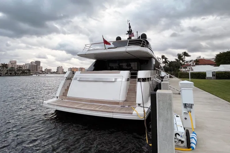 Slide: The Image of Luxurious 2022 Sanlorenzo SL 120A yacht docked by waterfront under cloudy skies. - 6