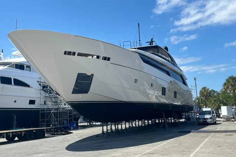 Slide: The Image of Sanlorenzo SL 120A 2022 yacht on dry dock under clear blue sky. - 9