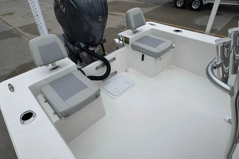 Slide: The Image of 2026 Bay Rider 2260 FS boat interior with seating and motor, showcasing modern design. - 17