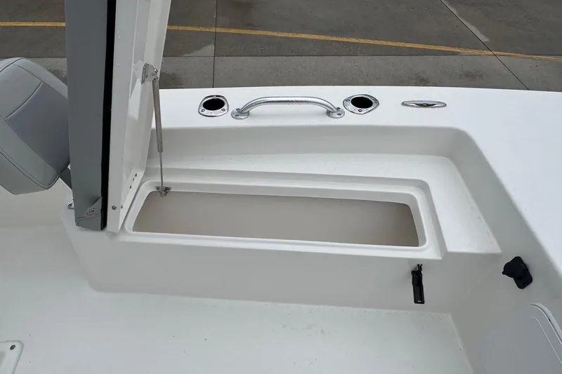 Slide: The Image of 2026 Bay Rider 2260 FS boat storage compartment with open lid and seating. - 9