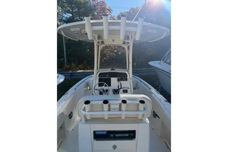 Slide: The Image of 2022 Grady-White Fisherman 257 boat interior with steering console and rod holders. - 10