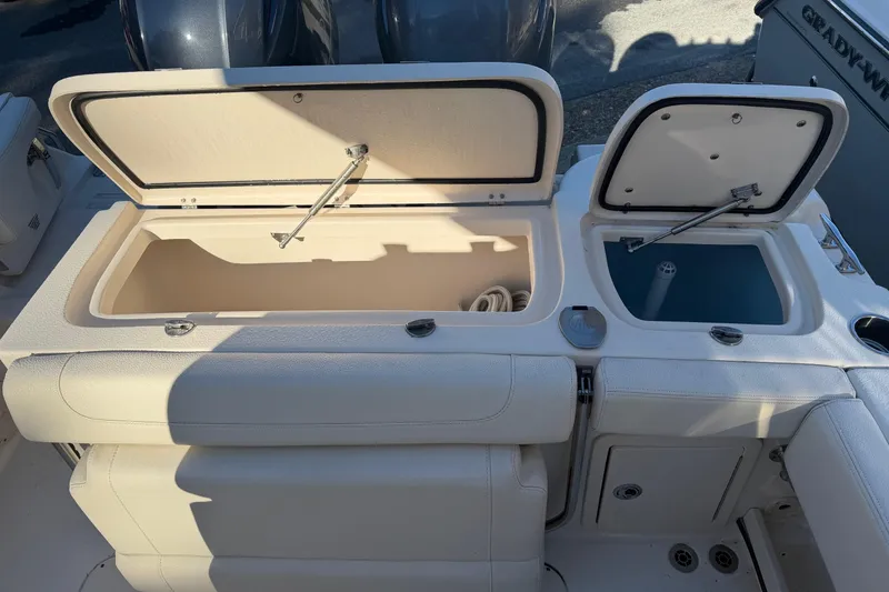 Slide: The Image of 2022 Grady-White Fisherman 257 boat storage compartments open, showcasing interior features. - 13