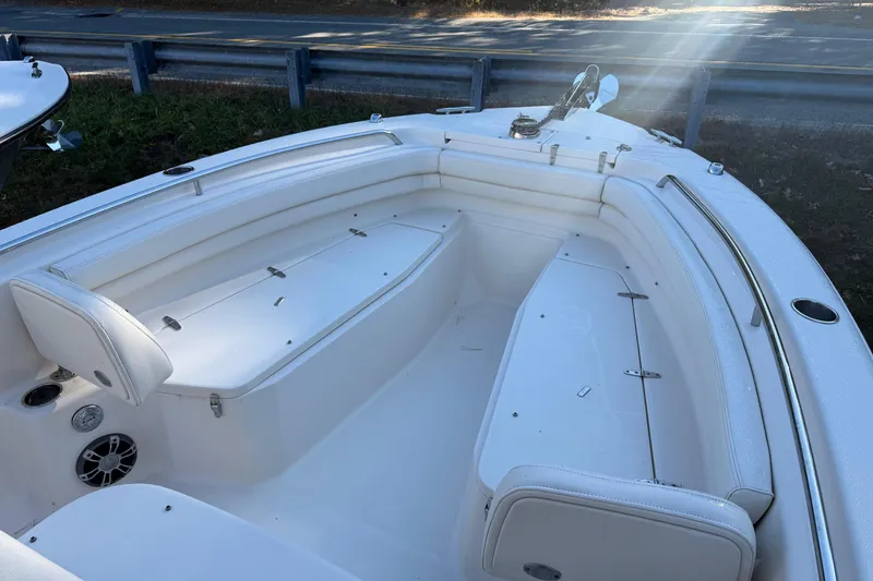 Slide: The Image of 2022 Grady-White Fisherman 257 boat interior with white seating and storage compartments. - 6